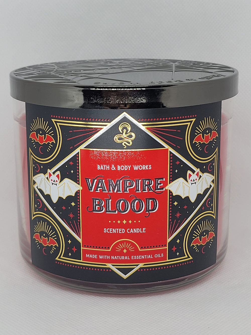 Bath & Body Works Vampire Blood candle, front view, enhances Halloween ambience.