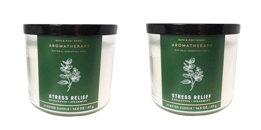 Bath & Body Works Aromatherapy 3-wick candle in eucalyptus spearmint scent gently lit for calming ambiance.