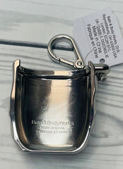 Bath & Body Works Chrome Hardcase PocketBac holder with sanitizer illustrates protected, stylish travel use