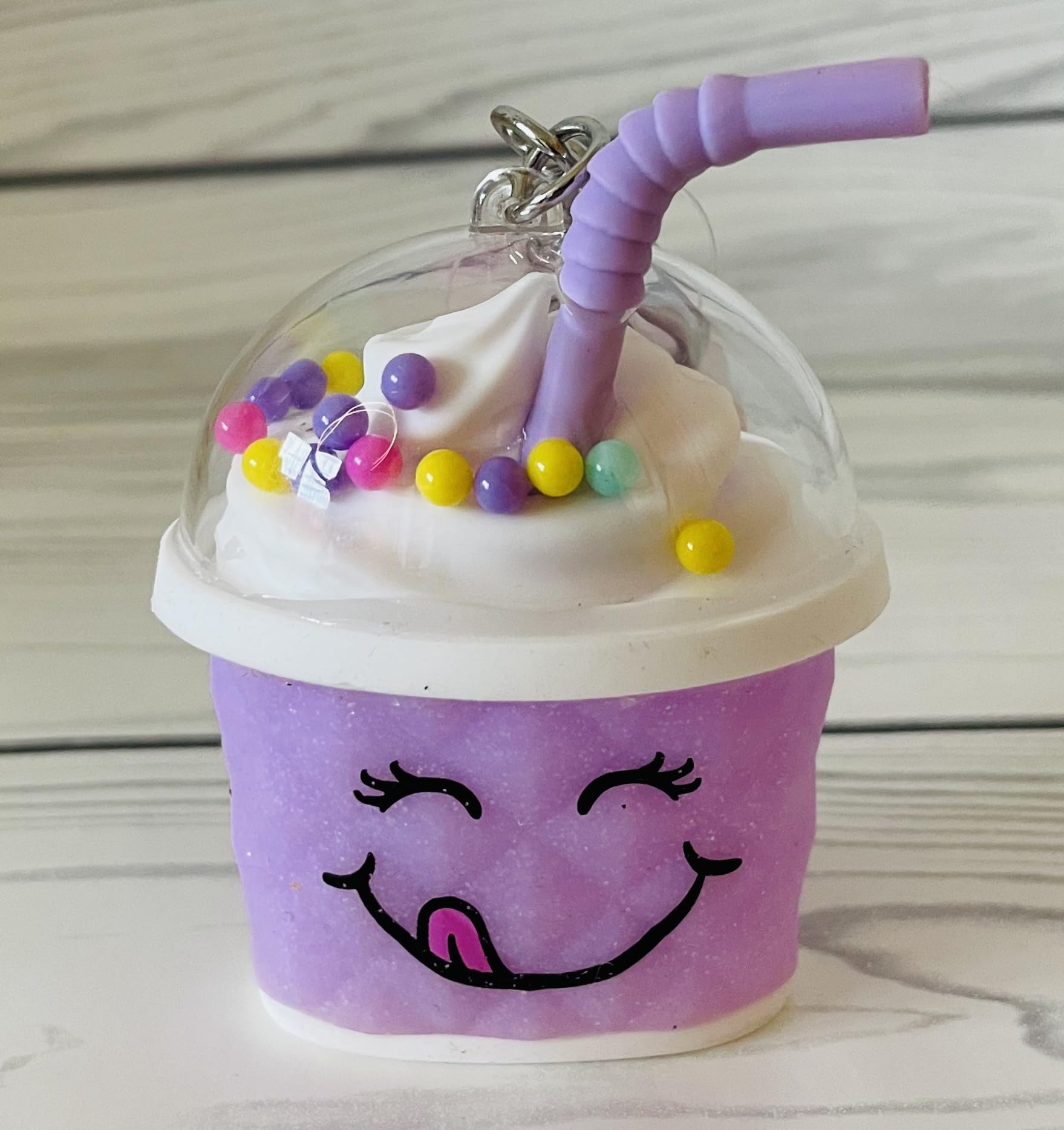 Bath & Body Works purple cup desktop display highlights decorative yet functional sanitizer holder.