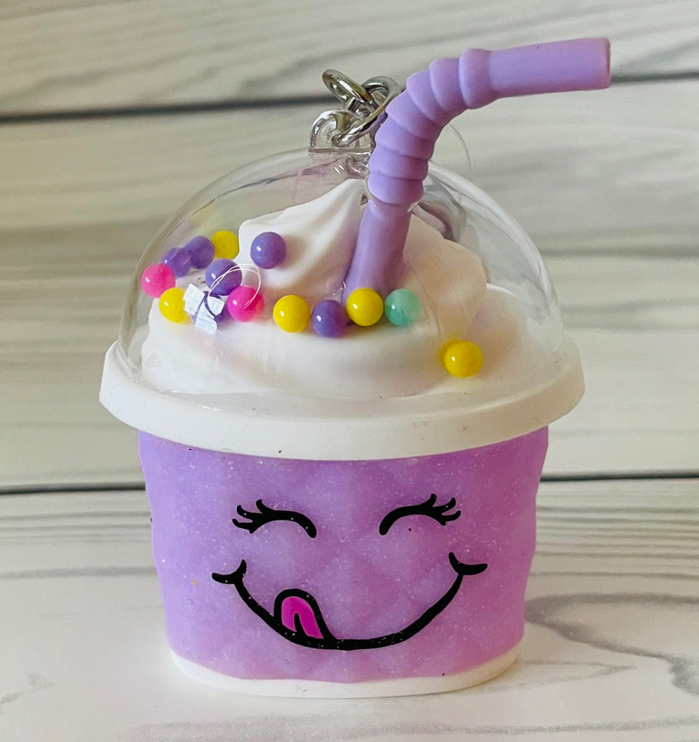 Bath & Body Works purple cup desktop display highlights decorative yet functional sanitizer holder.