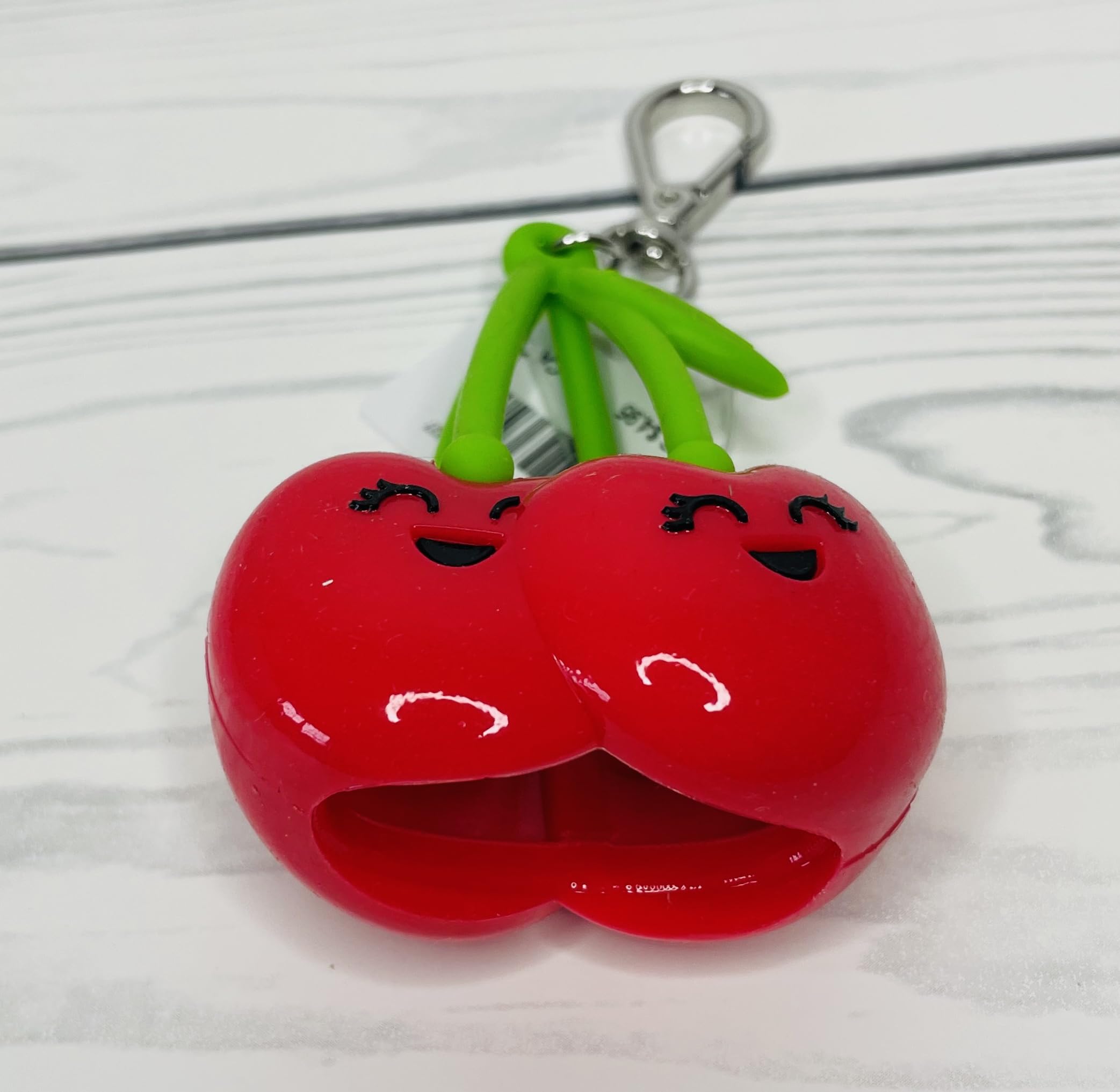 Bath & Body Works PocketBac holder close-up highlights festive cherries and versatile on-the-go usage