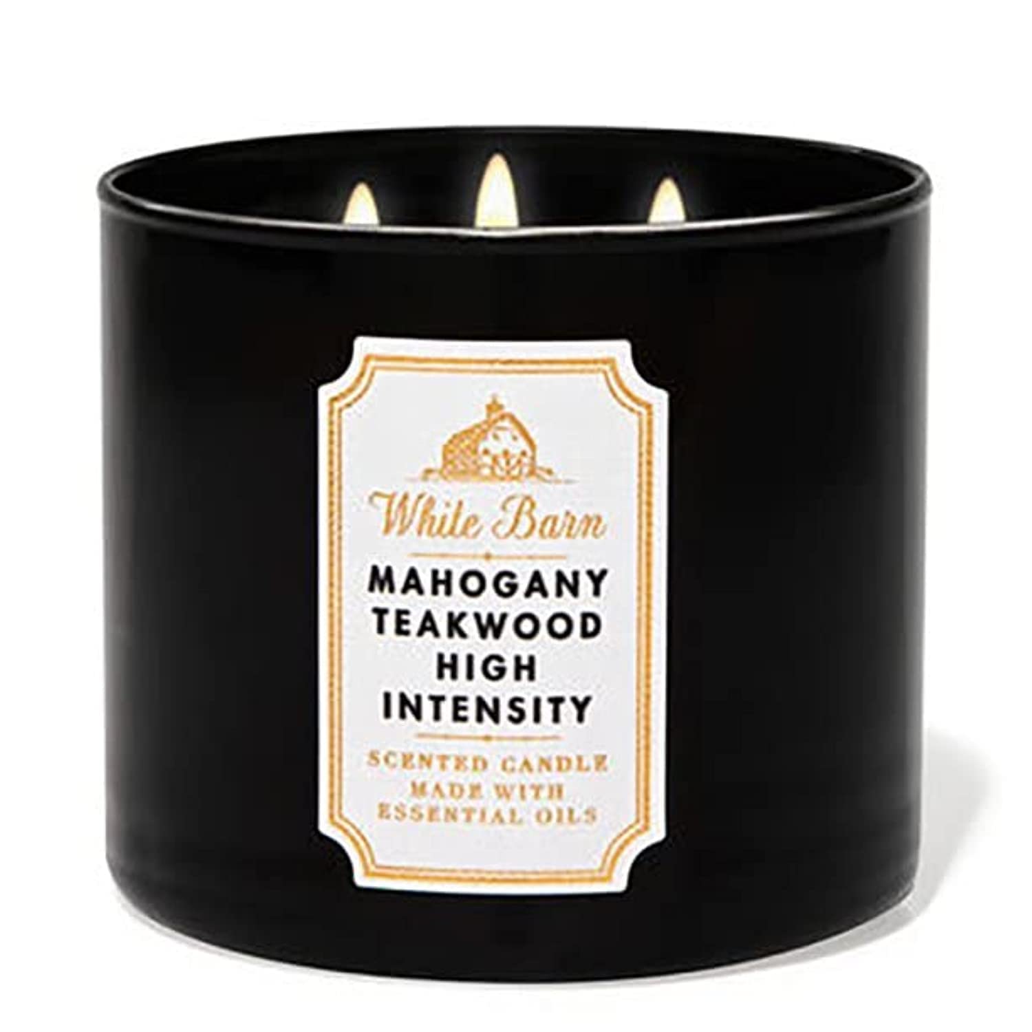 Bath & Body Works White Barn 3-Wick Candle Mahogany Teakwood creates a warm, inviting ambiance.