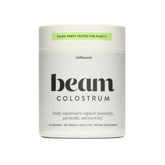 Beam Colostrum Powder bottle with scoop highlights immune support and gut health.