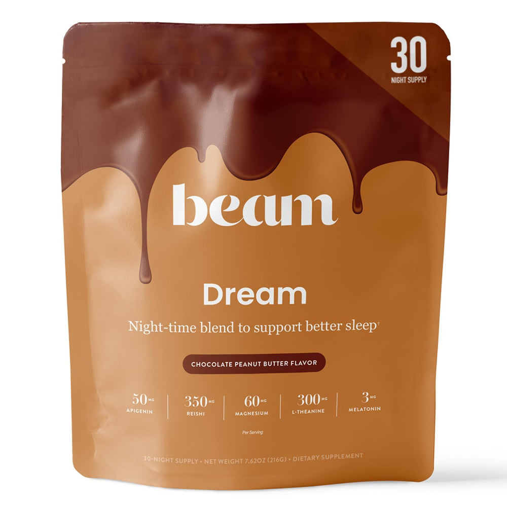 Beam Dream Sleep Powder bottle on nightstand suggesting calm evening routine.