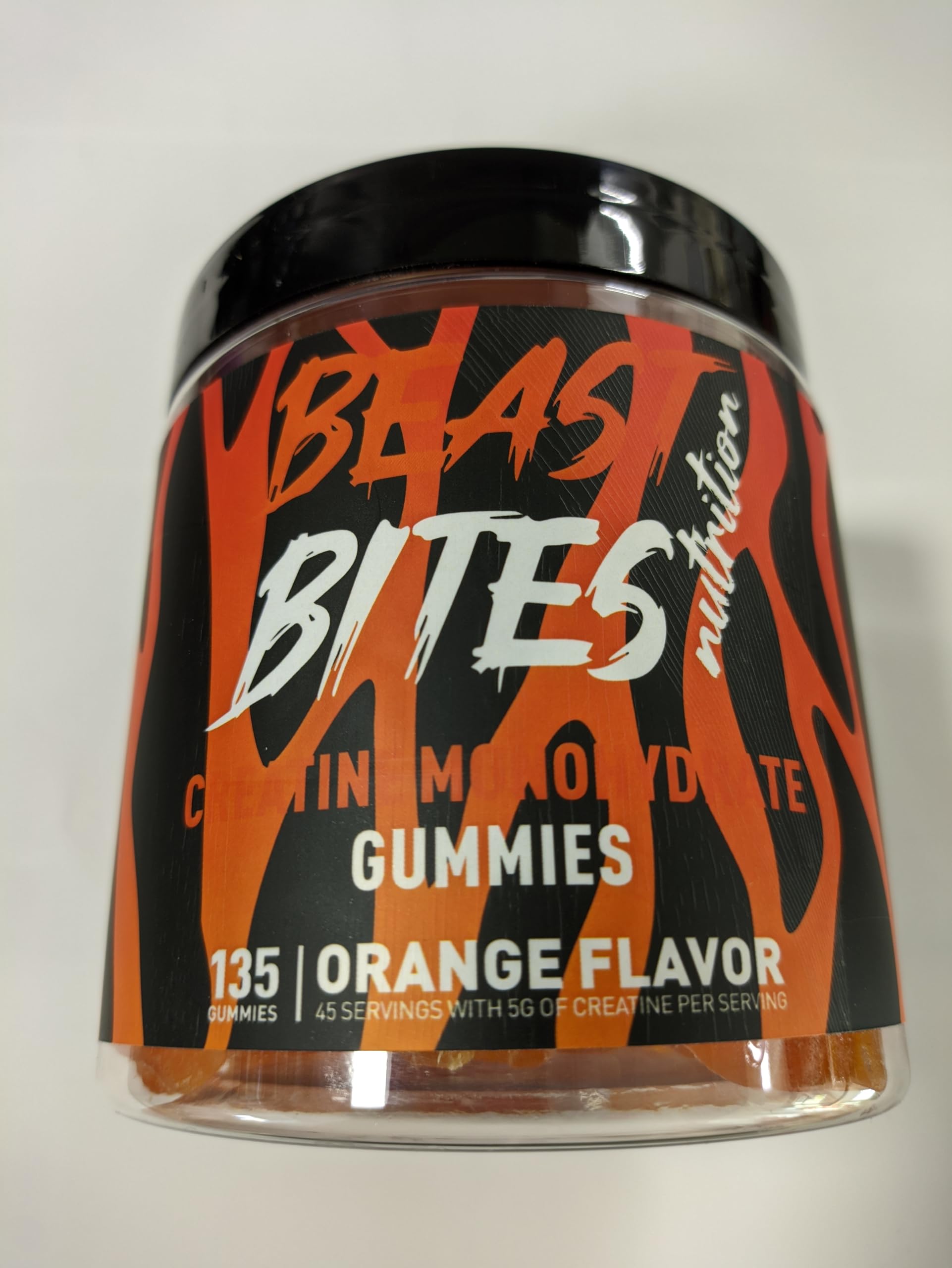 BEAST BITES Creatine Monohydrate Gummies orange bottle for convenient pre- or post-workout support.