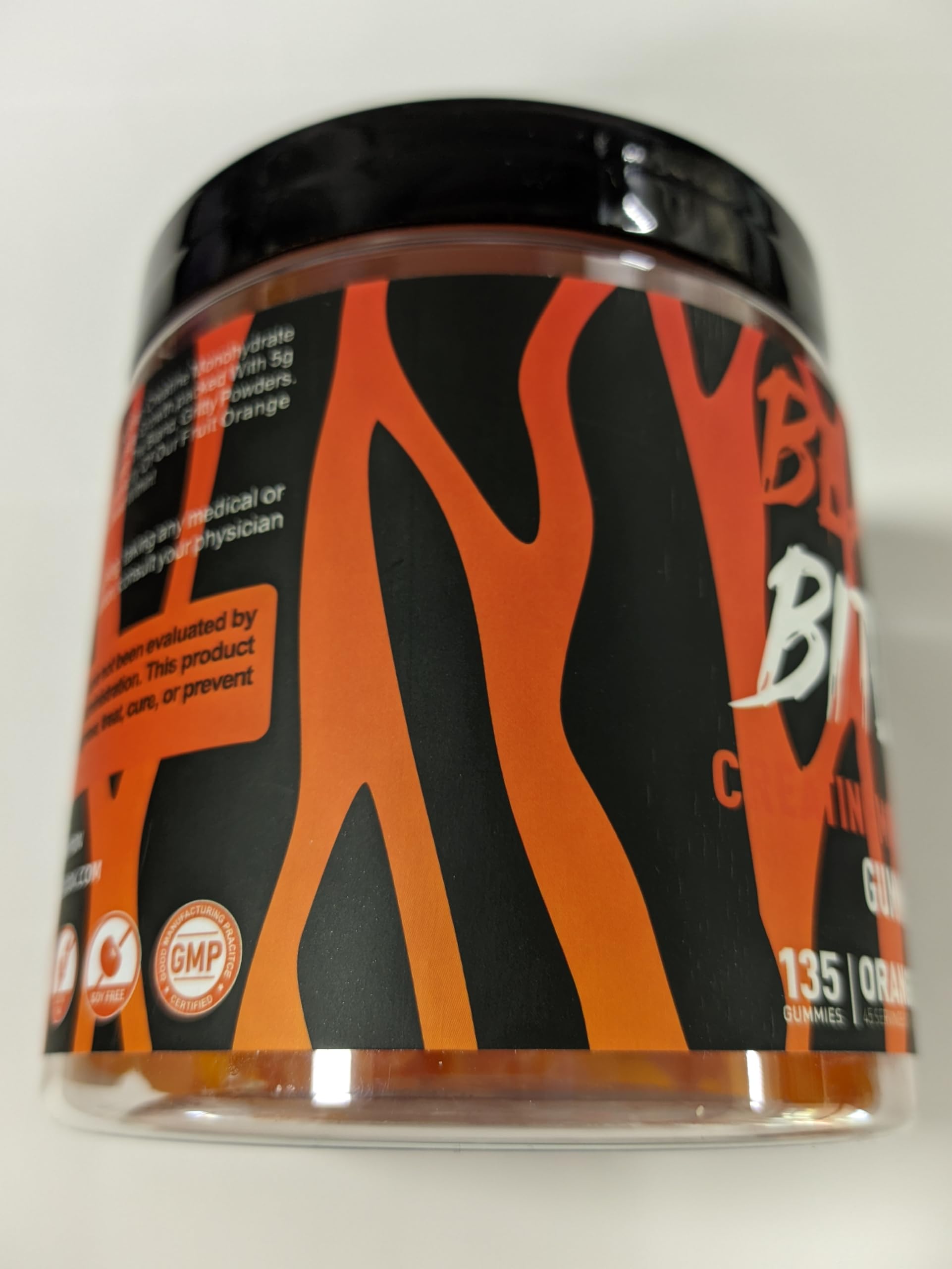 BEAST BITES orange-flavor gummies close-up emphasizing tasty, sugar-free option.