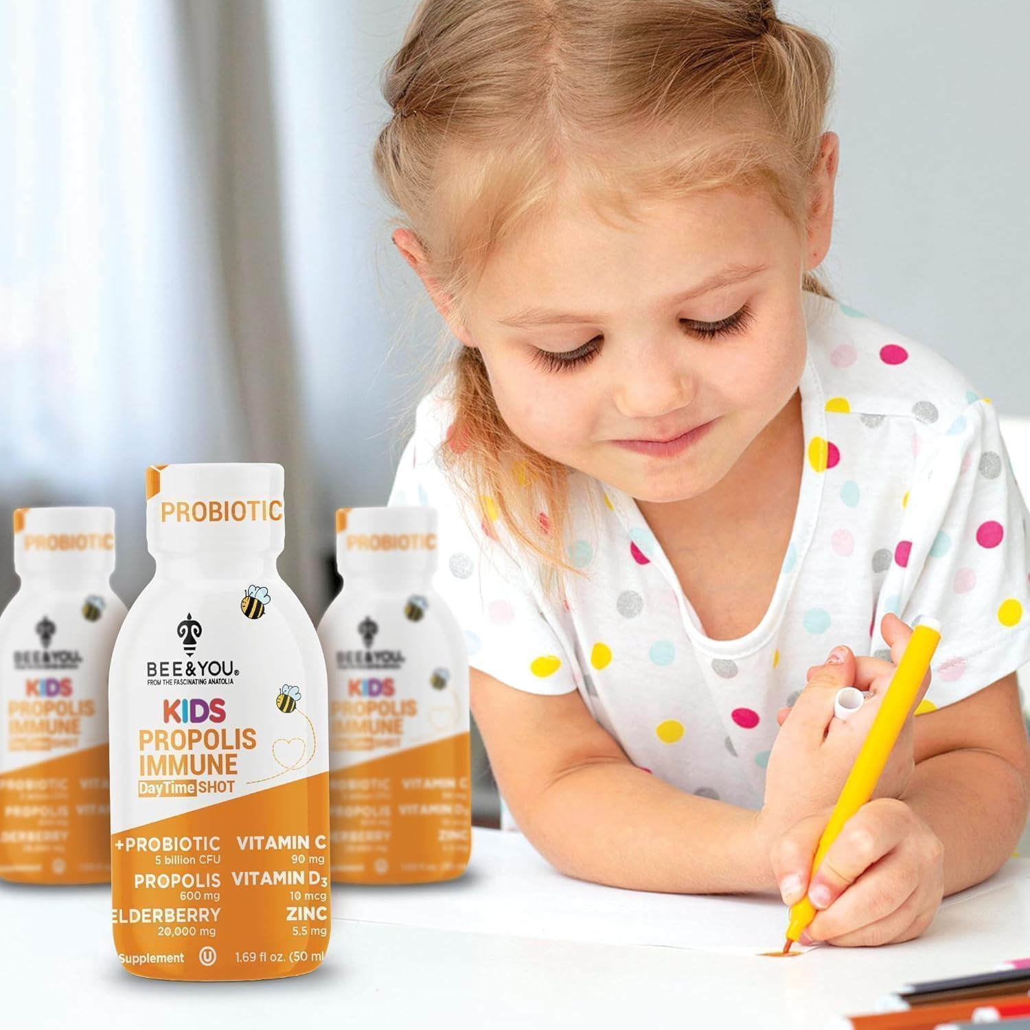 Child using Bee & You Propolis Immune Shot after school