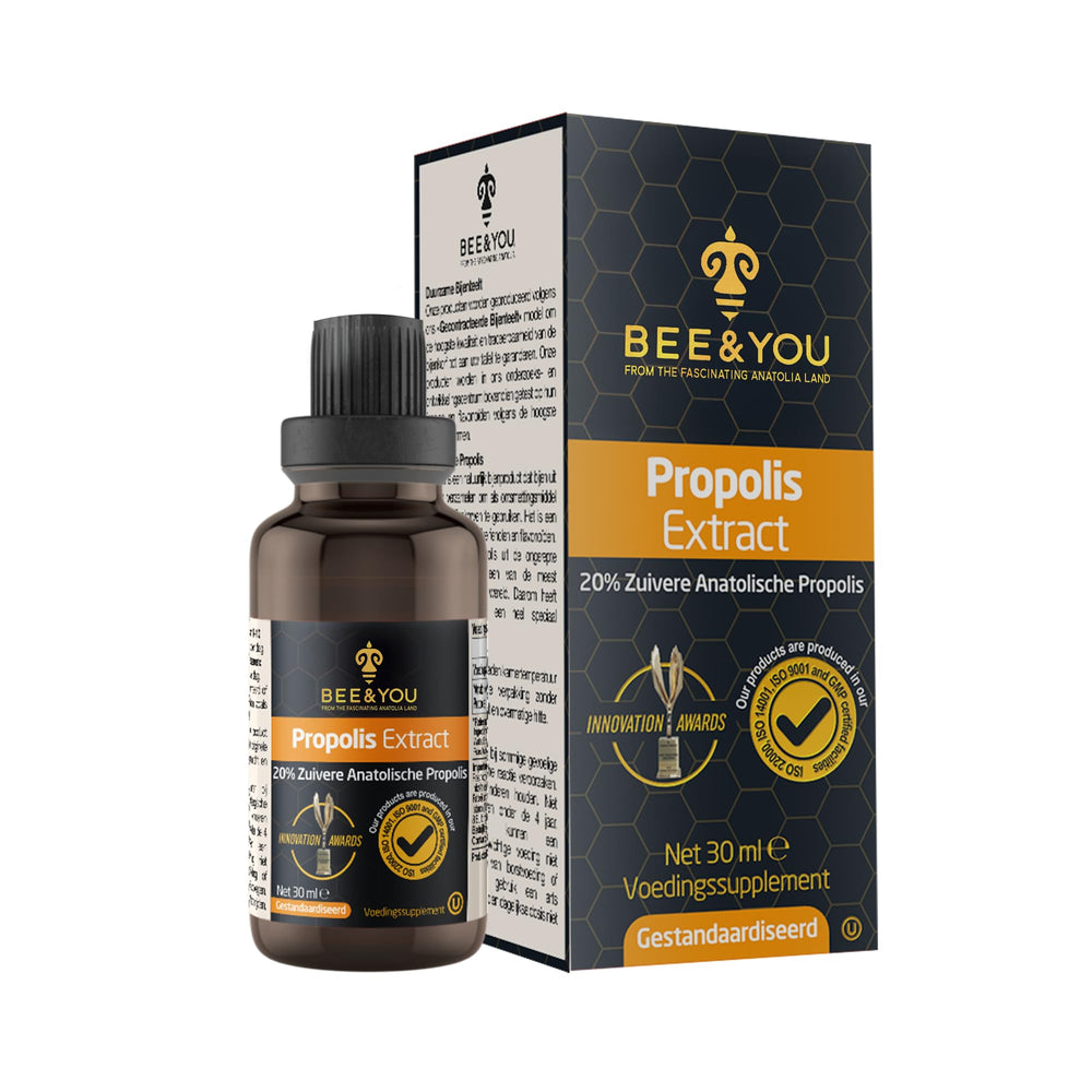 Pipette and amber propolis liquid ready for daily dosing with the drops.