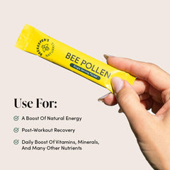 Raw bee pollen stick pack with label highlighting enzymes and vitamin B content