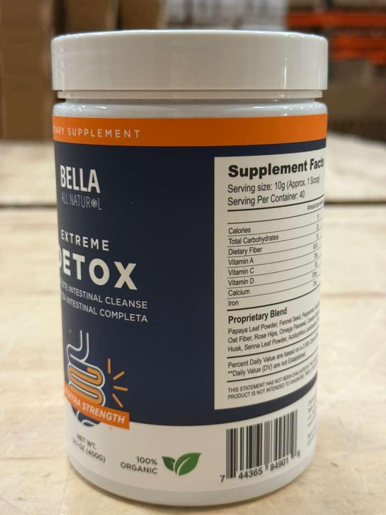 Bella All Natural Detox Powder Mango mixed in water for a refreshing drink.