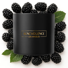 Benevolence LA 3-wick candle in black wax with Baies scent creates festive ambiance.