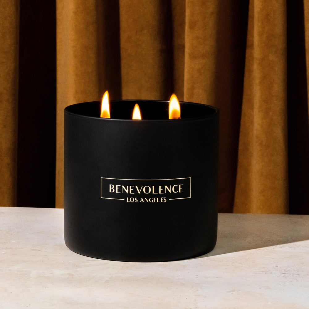 Benevolence LA candle adds warm ambiance to dining room settings.