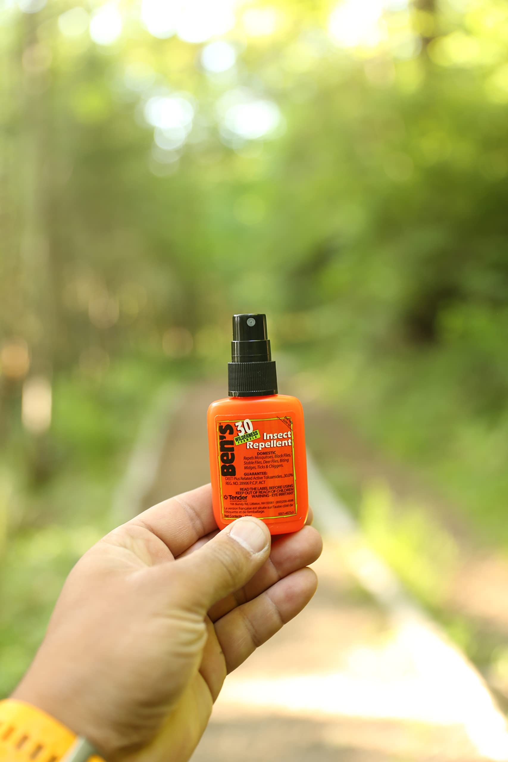 Outdoor enthusiasts using Ben's DEET repellent during hikes and activities