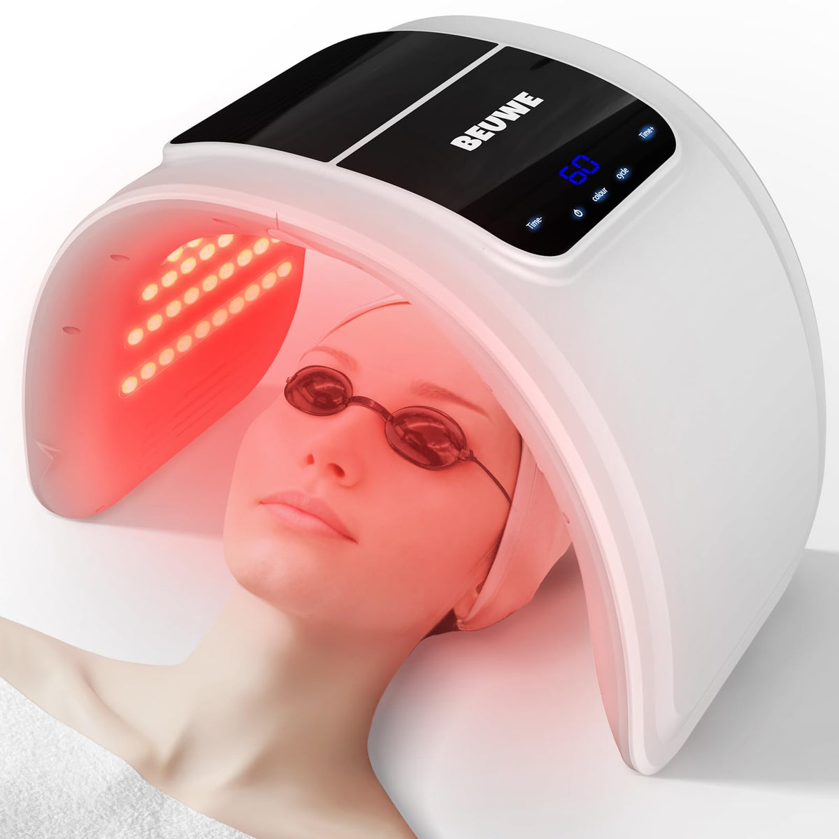 Beuwe red-light therapy mask on the face for at-home skin rejuvenation.