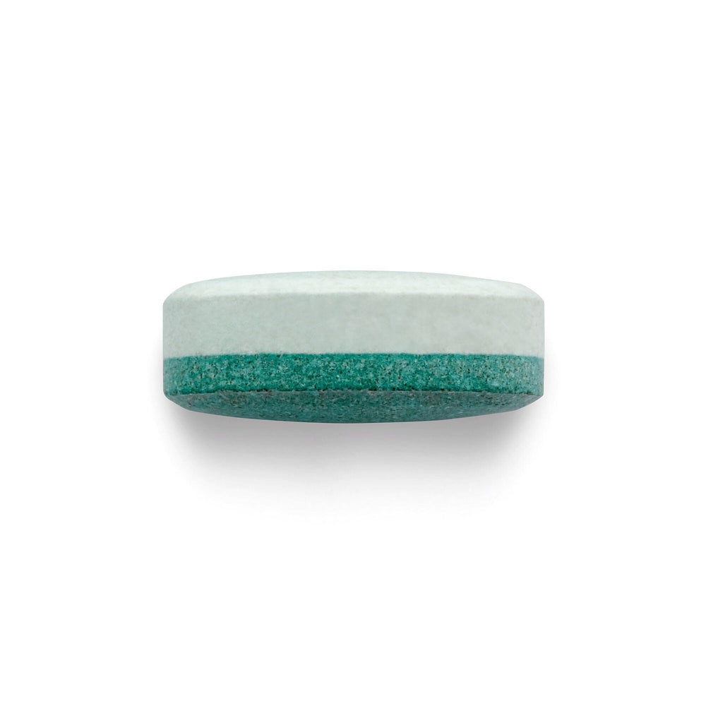 BEYOND RAW Anabolic Sleep scoop beside glass for nightly serving.