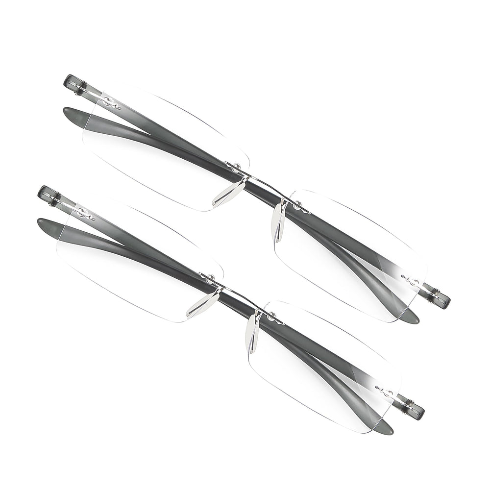 Bhigh blue light reading glasses on a desk beside a monitor