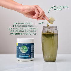 BIOHM Digestive Greens being poured into water for quick mixing.