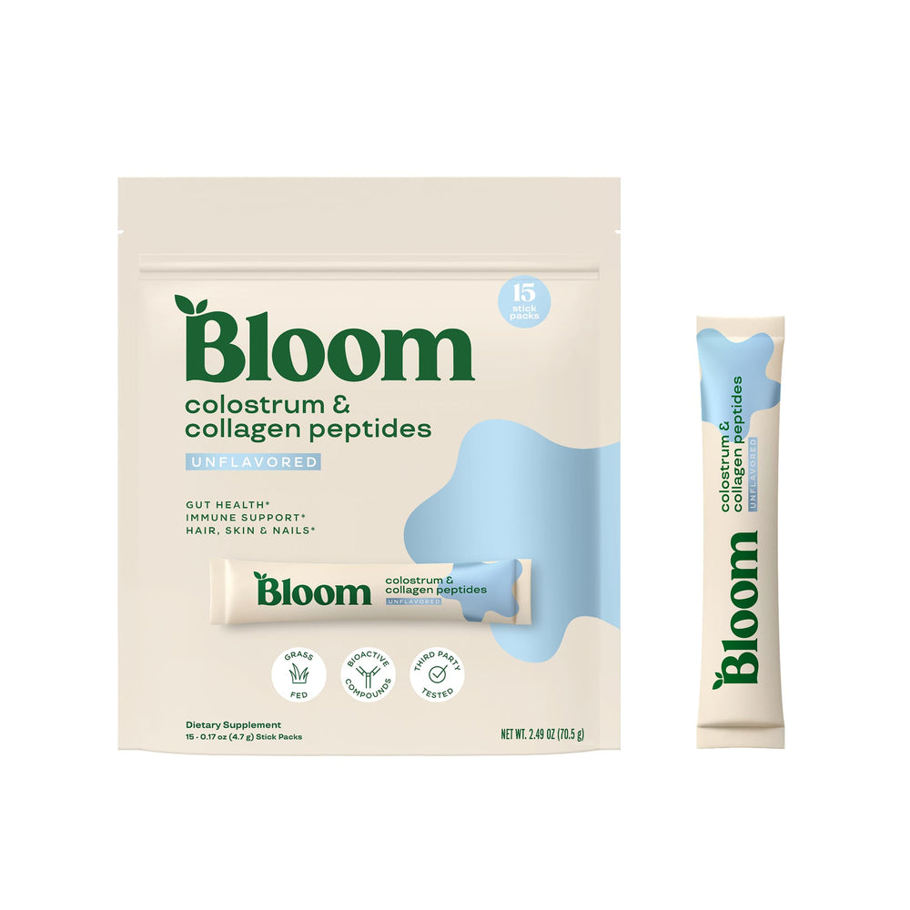 Bloom Nutrition colostrum packet open for convenient immune and gut support.