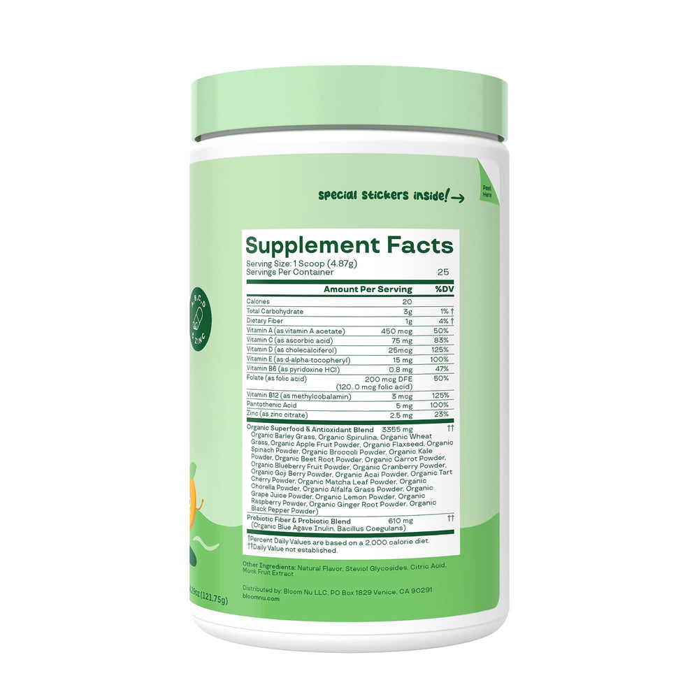 Bloom Nutrition tropical punch powder dissolving in water beside a glass for kids