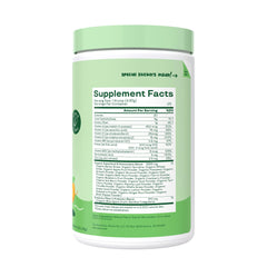 Bloom Nutrition tropical punch powder dissolving in water beside a glass for kids