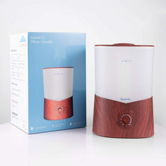 BlueHills diffuser with ambient lights complements modern decor in dark wood.