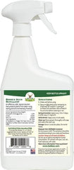 Applying Bobbex Deer Repellent to shrubs in the garden for deer deterrence.