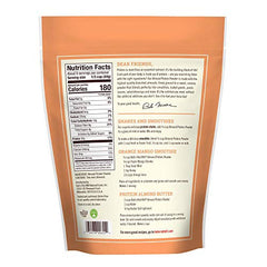 Bob's Red Mill almond protein powder scoop into a shaker bottle for smoothies.