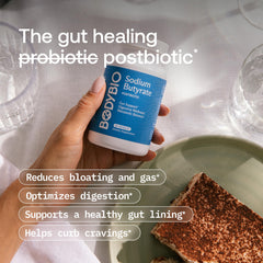 BodyBio Butyrate bottle being poured for convenient use.