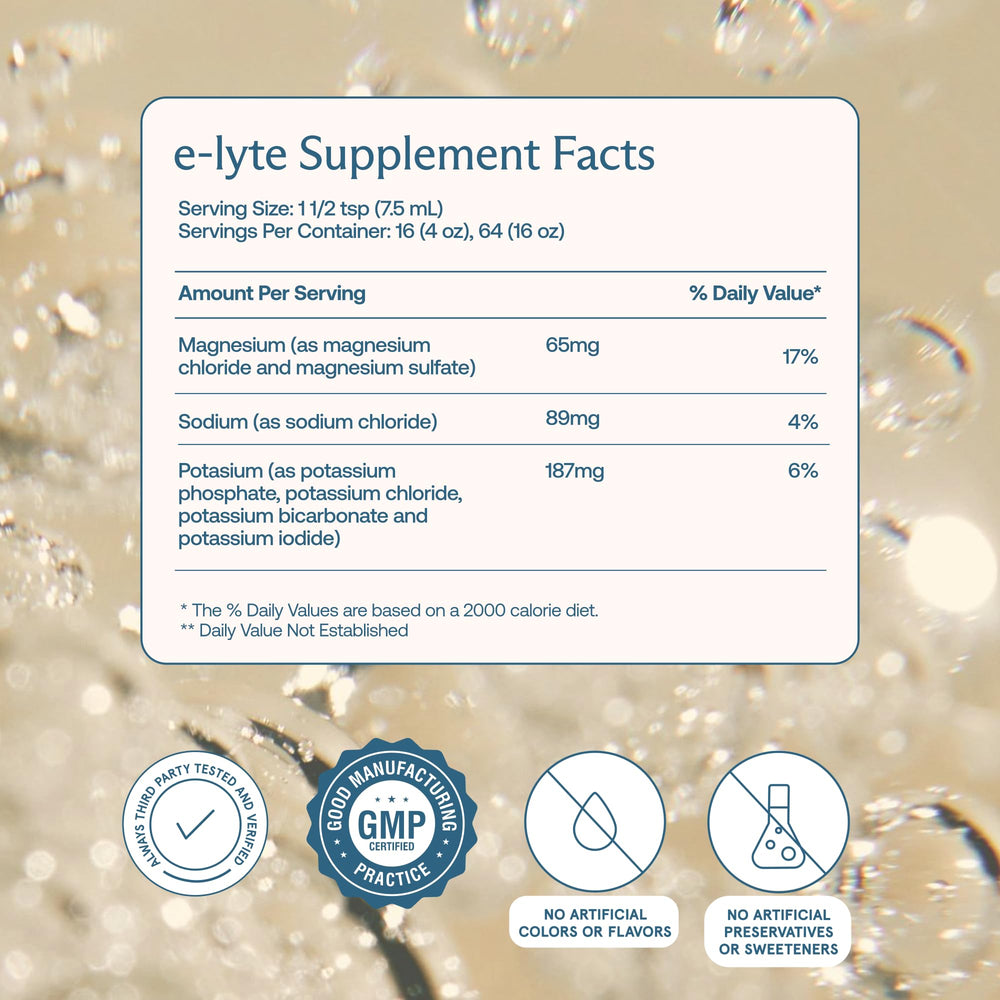 BodyBio e-Lyte bottle being poured into a glass for sugar-free hydration.