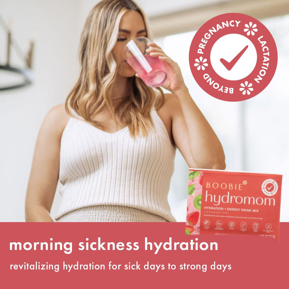 Boobie Hydromom travel-ready packet being opened for travel hydration.
