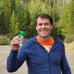 Boost Oxygen canister in hand for quick breaths during activity.