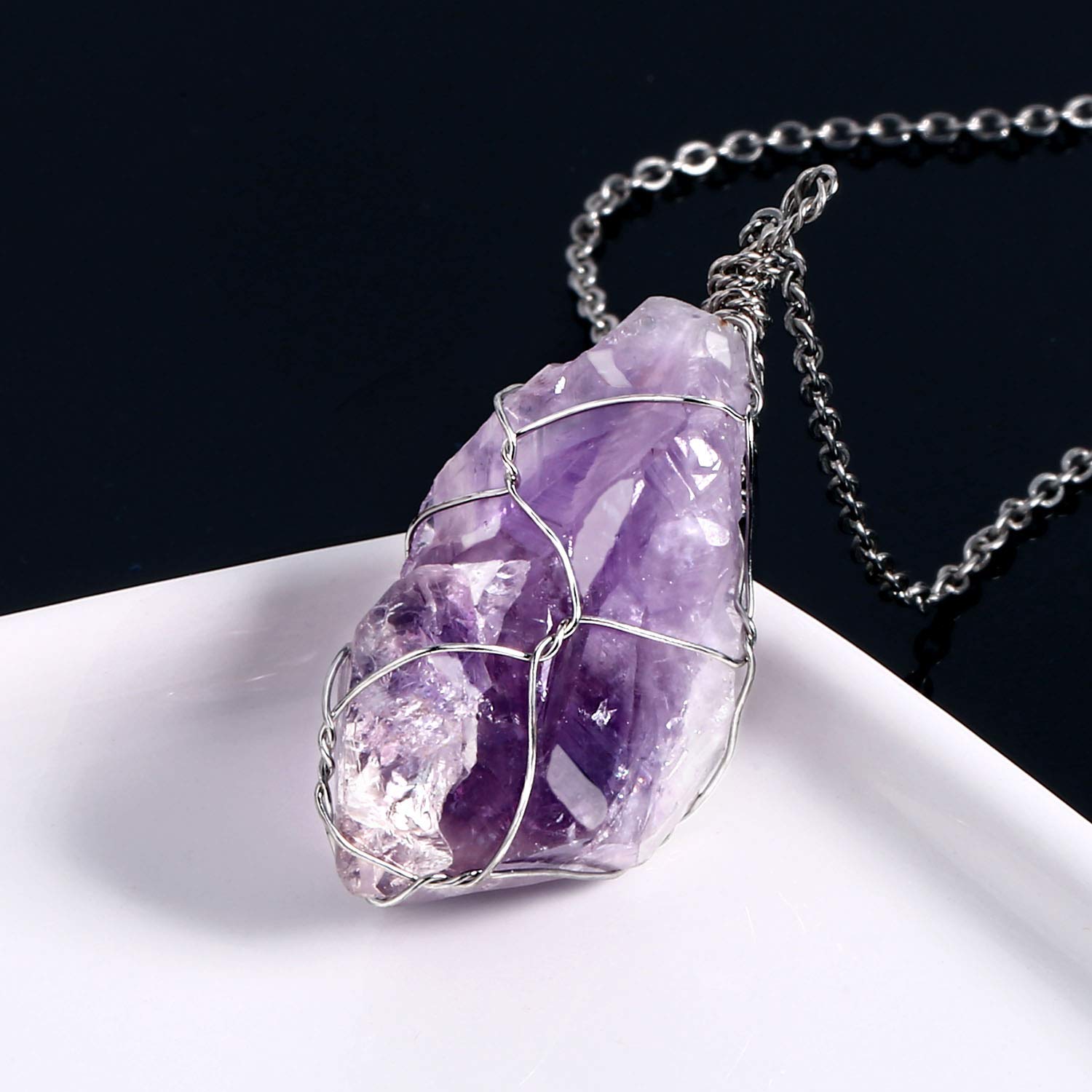 BoutiqueLovin amethyst crystal necklace closeup showing vivid purple facets.