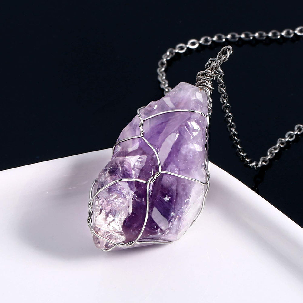 BoutiqueLovin amethyst crystal necklace closeup showing vivid purple facets.