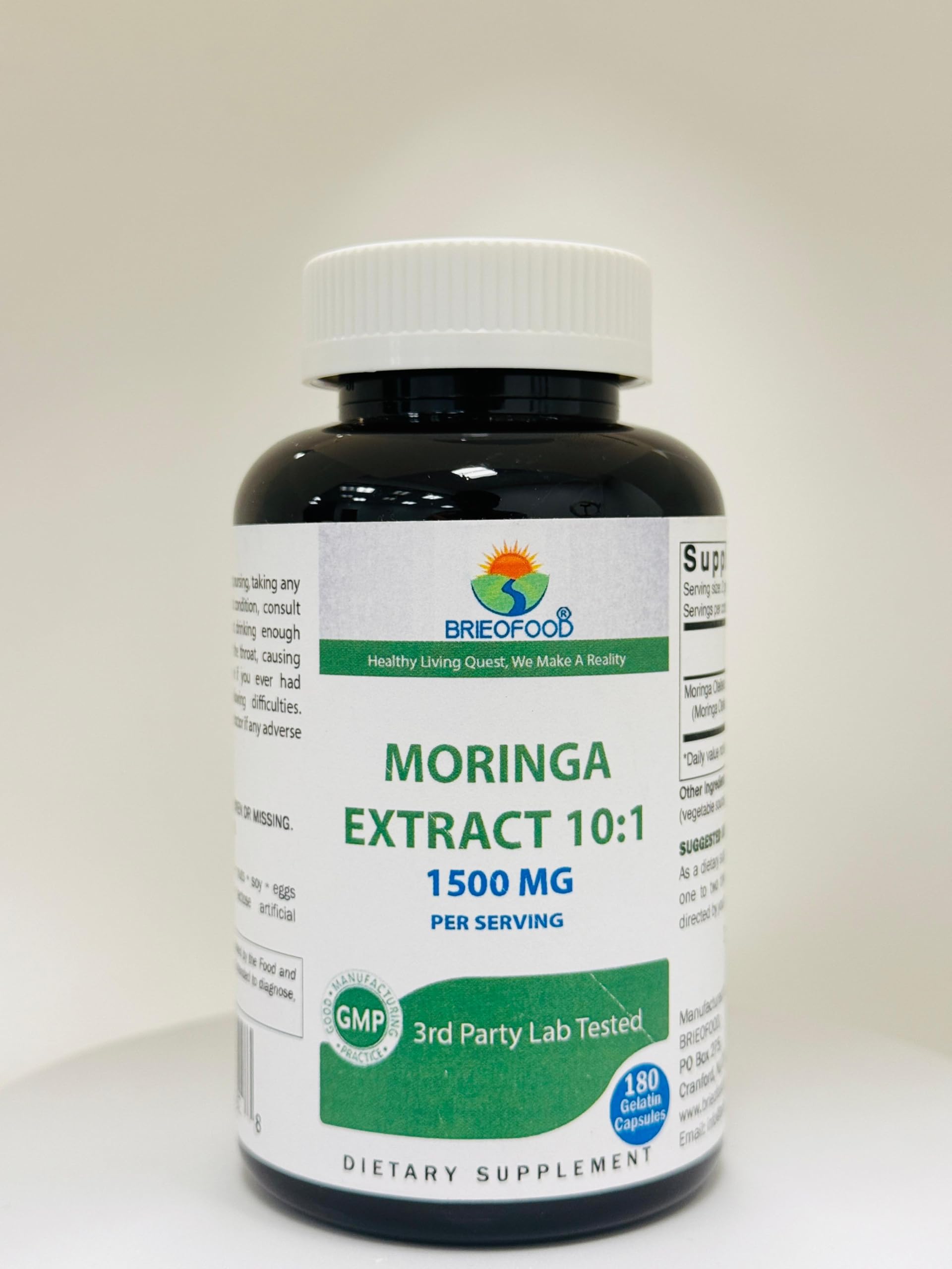 Brieofood Moringa bottle pouring capsules into a container