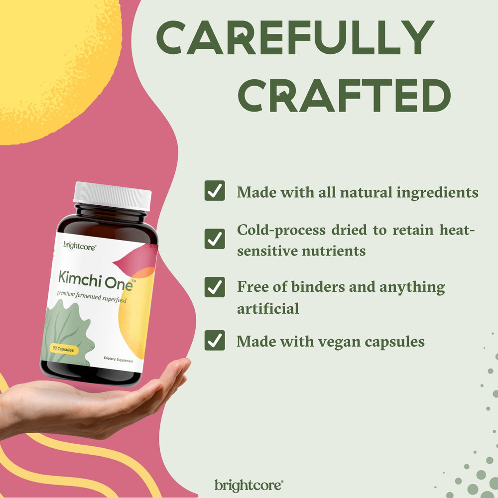 Glass with Brightcore Kimchi One capsules for a meal-time routine.