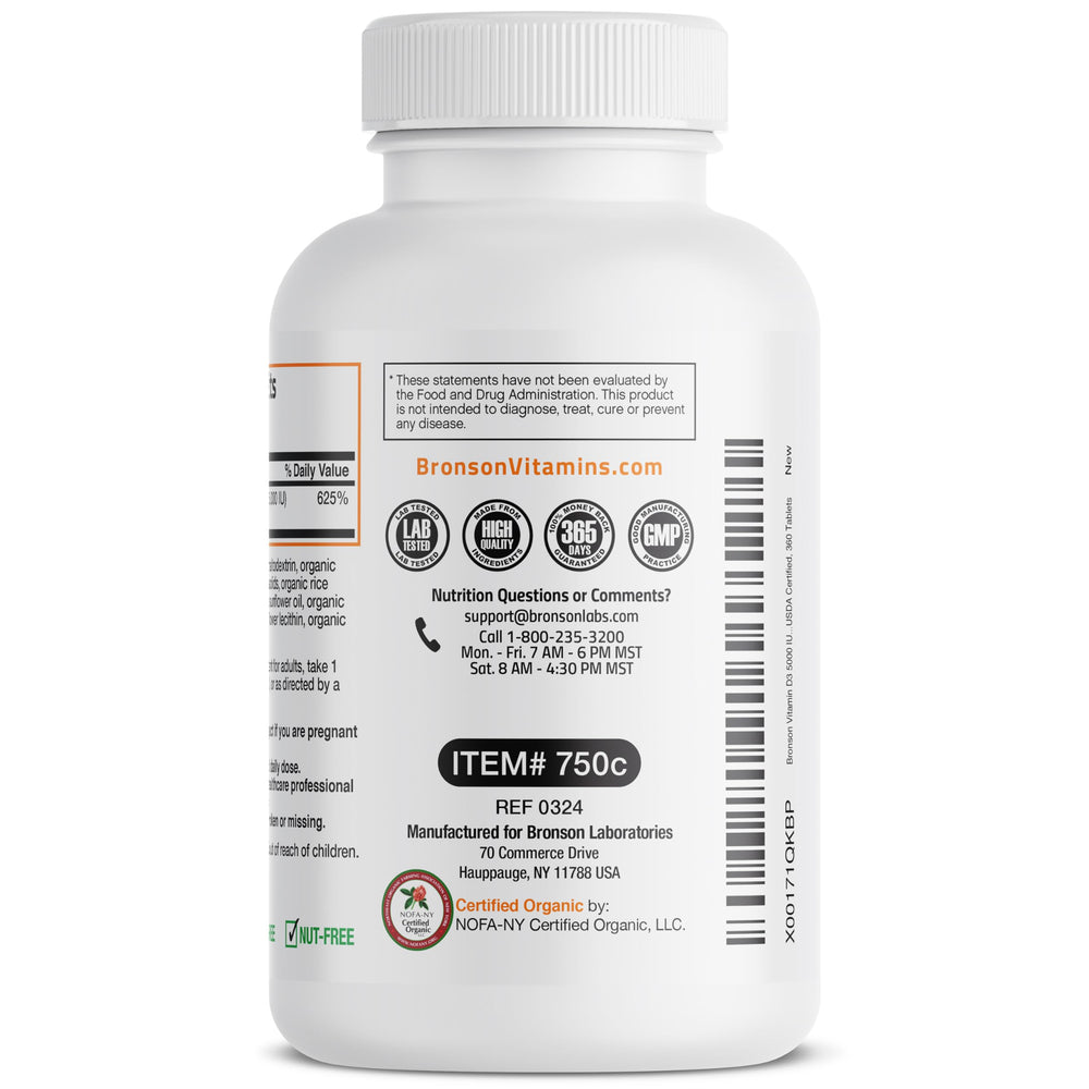 Bronson Vitamin D3 5000 IU bottle on wooden surface in natural setting.