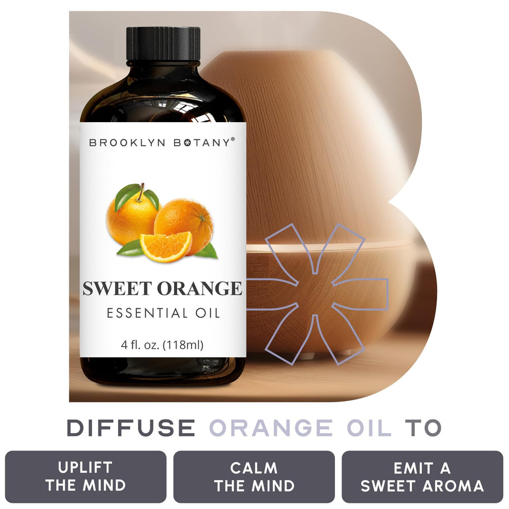 Brooklyn Botany Sweet Orange Oil beside fresh citrus for a natural daytime refreshment.