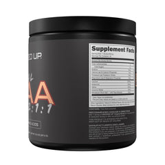 Bucked Up Original BCAA Apple Jacked glass captures refreshing hydration mid-workout.
