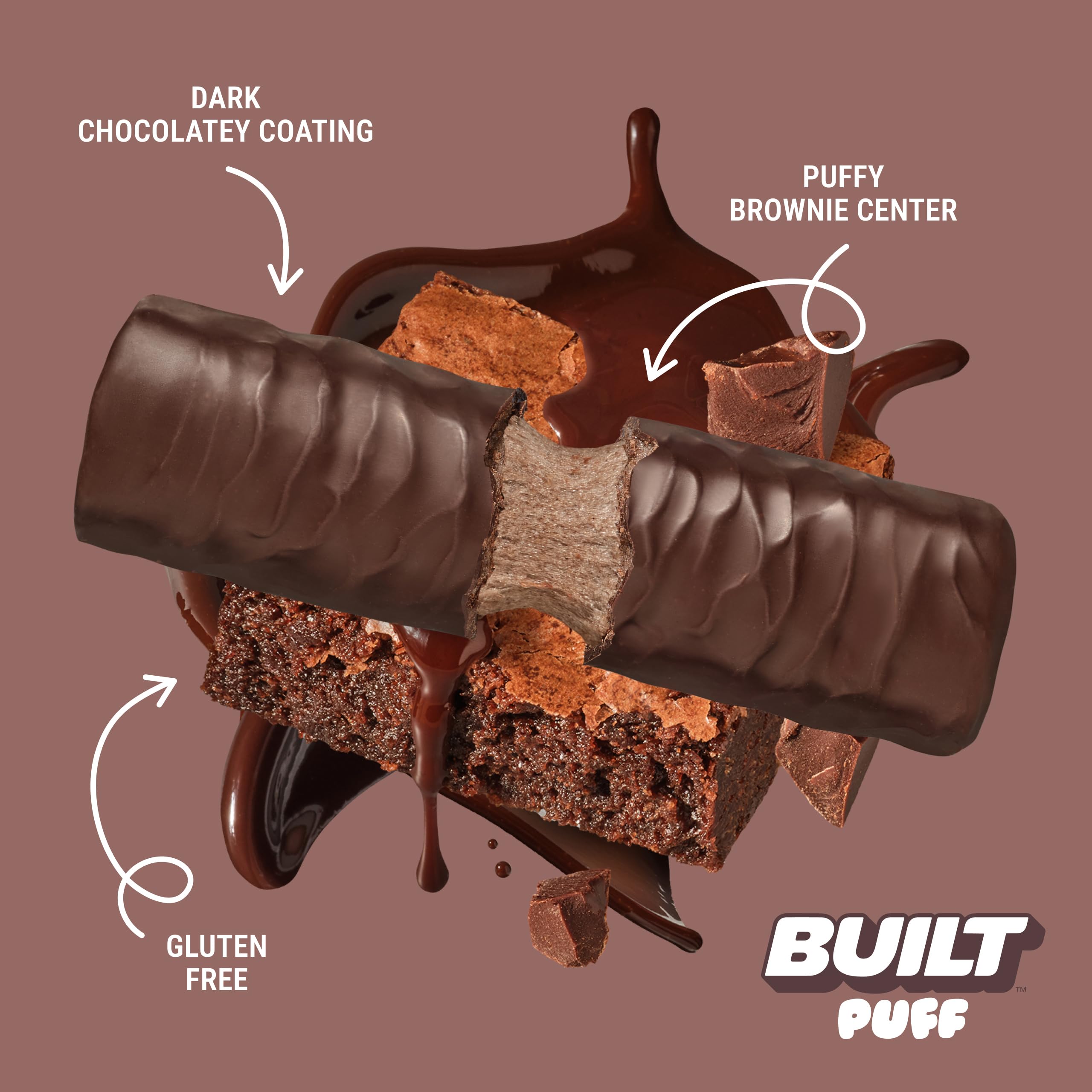 Hand holds Built Bar Puff Brownie Batter bar for quick protein on the move.