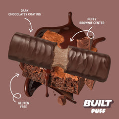 Hand holds Built Bar Puff Brownie Batter bar for quick protein on the move.