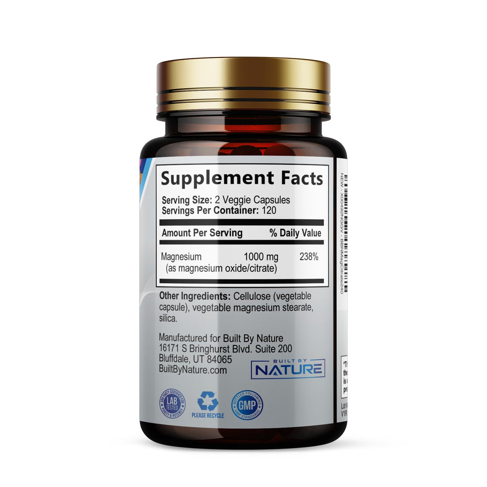 Built By Nature capsules on wooden desk for daily routine.