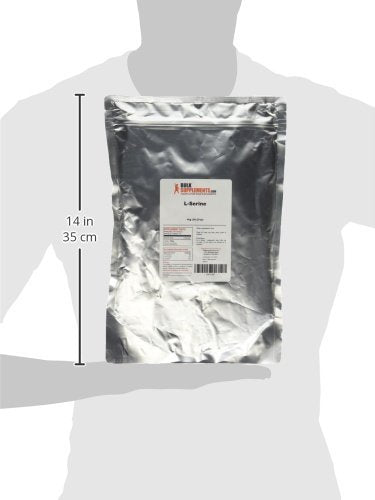 BulkSupplements L-Serine powder in glass bottle on counter ready to blend