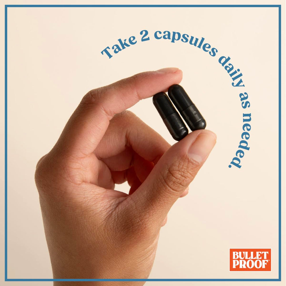Bulletproof charcoal capsules on a kitchen counter.