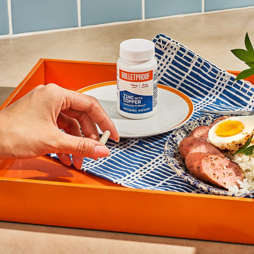 Capsules in glass with Bulletproof Zinc with Copper for convenient intake
