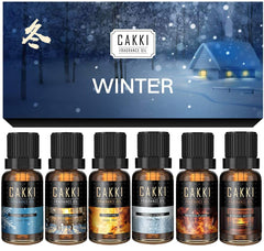 CAKKI Winter Collection: six fragrance oils in amber bottles ready for diffusers and candles.