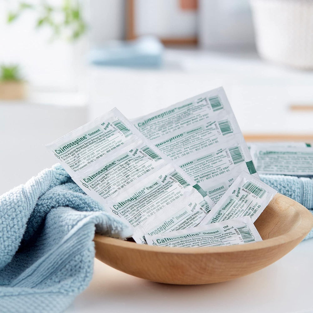 Calmoseptine ointment application demonstrates gentle use on irritated skin.