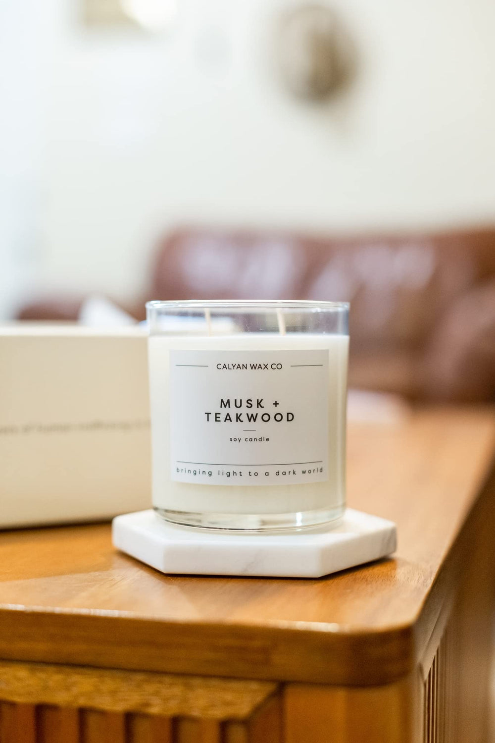 Calyan five percent donation nonprofit candle highlighting charitable purpose.