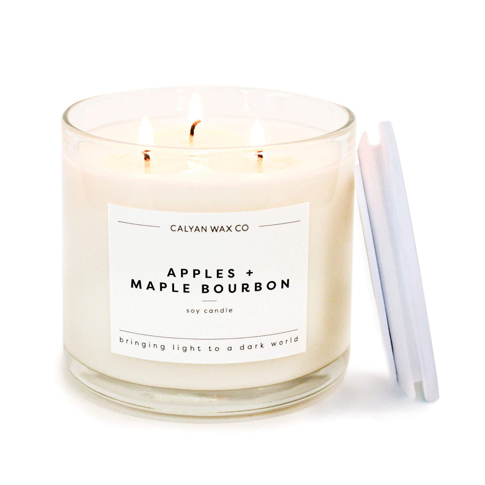 Calyan Wax Co. Apples & Maple Bourbon bottle closeup highlighting fragrance notes for a cozy ambiance