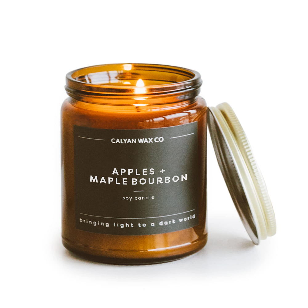 Calyan Wax Co. Apples and Maple Bourbon candle in an amber jar for cozy ambiance